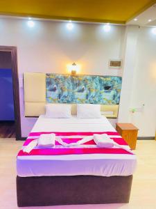 Voodi või voodid majutusasutuse Wilroma Hotel&Resort toas