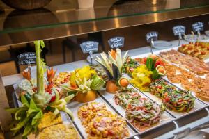 a buffet filled with lots of different types of food at Oasis Lanz Beach Mate in Costa Teguise