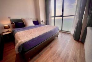 Ένα ή περισσότερα κρεβάτια σε δωμάτιο στο Beachfront 1BR Condo with Breathtaking Views +24 φωτογραφίες