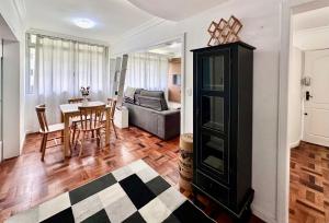 a living room with a couch and a table at João Machado Fortes in Florianópolis