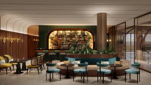 a restaurant with tables and chairs and a bar at voco Quang Binh Resort by IHG in Dong Hoi +88 photos
