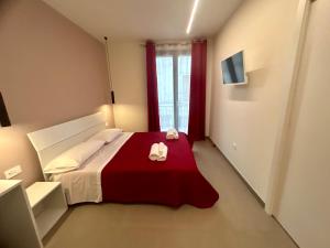Postel nebo postele na pokoji v ubytování Arkè Rooms