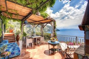 a house with a view of the ocean at POSEA Collection - Villa Ponente in Positano