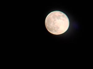 a close up of a moon in the sky at واي رم in Wadi Rum
