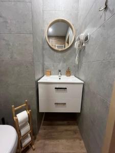 a bathroom with a white sink and a mirror at Pawłówka B&B in Szklarska Poręba +26 photos