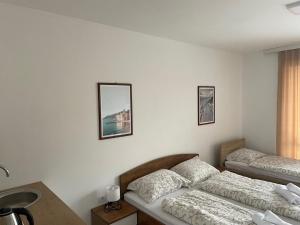 Postel nebo postele na pokoji v ubytování Novel S&S