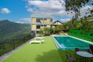 a house with a swimming pool and a building at Kelvin Eco Resort in Dedugala