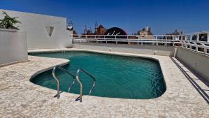 a swimming pool on the roof of a house at Amérian Executive Córdoba Hotel in Córdoba