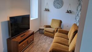 Μια τηλεόραση ή/και κέντρο ψυχαγωγίας στο Appartement 2 à 4 personnes à la campagne