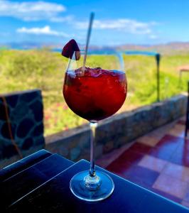 a drink in a glass sitting on a table at Vista Condor Lodge in Puerto Viejo