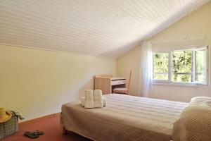 Postel nebo postele na pokoji v ubytování Hôtel de Porticcio