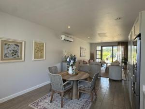 a dining room with a table and chairs at Le Bourgette 28 Misty Wink in Franschhoek