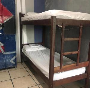 a couple of bunk beds in a room at Mangue Inn Hostel in Búzios