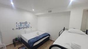 Postel nebo postele na pokoji v ubytování Surfo House Hotel & Hostel