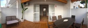 a table and chairs in front of a house at casa en Islantilla in Isla Cristina +2 photos