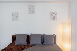 a bedroom with a bed with three signs on the wall at UNIQUE Plaza Higuitos in Almuñécar
