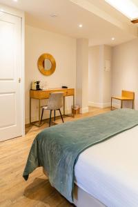 Postel nebo postele na pokoji v ubytování Hotel Boutique ADOLFO