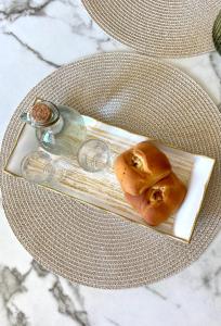 a plate with two food items on a table at Mons Apartments in Spílion +4 photos
