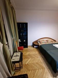 Postel nebo postele na pokoji v ubytování Kaunas Center Apartment