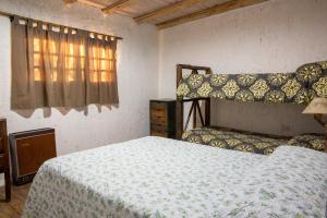 En eller flere senge i et værelse på Coirones del Pedemonte + 42 billeder