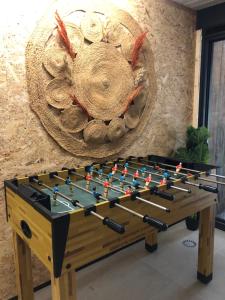 a foosball table in a room with a wall at Vakantiewoning De Passerelle in Geraardsbergen