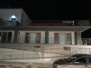 a car parked in front of a building at night at Caraceni Apartaments 2 in Castel di Sangro