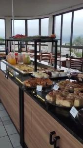 a buffet line with many different types of food at Hoteis Cattoni in Lages