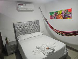 Postel nebo postele na pokoji v ubytování Apartaestudios Galanni