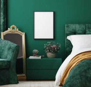 a bedroom with a bed and a mirror and a chair at Green Houses in Wijk bij Duurstede +2 photos