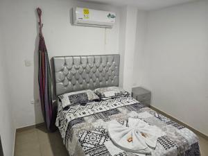 Postel nebo postele na pokoji v ubytování Apartaestudios Galanni