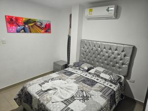 Postel nebo postele na pokoji v ubytování Apartaestudios Galanni