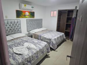 Postel nebo postele na pokoji v ubytování Apartaestudios Galanni