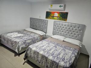 Postel nebo postele na pokoji v ubytování Apartaestudios Galanni
