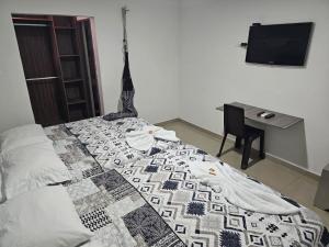 Postel nebo postele na pokoji v ubytování Apartaestudios Galanni