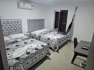 Postel nebo postele na pokoji v ubytování Apartaestudios Galanni