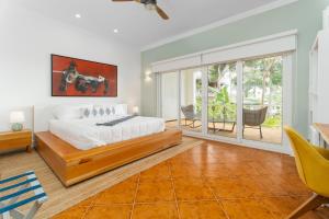 Voodi või voodid majutusasutuse Blue Roatan Resort toas