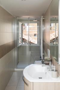 a bathroom with a white sink and a shower at San Marco Comfort in Venice