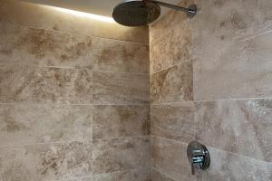 a bathroom with a shower with a sink at Landhaus Meerbusch bei Düsseldorf in Meerbusch