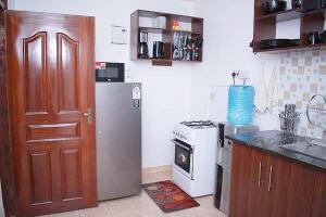Kuchyň nebo kuchyňský kout v ubytování Bomani -2 Tom Mboya Apartment + 28 fotografií