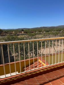 a metal railing on a bridge over a river at Casa Roma in Casinos +28 photos