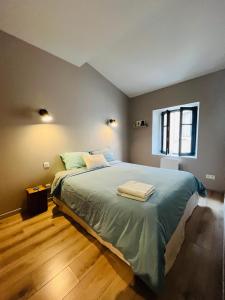 Ένα ή περισσότερα κρεβάτια σε δωμάτιο στο Maison petite côte