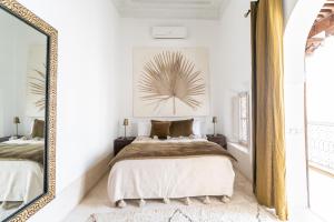 Letto o letti in una camera di Riad Nomada Marrakech