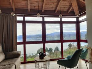 a living room with a large window with a view at Casa da Ramona in Ribadavia +39 photos