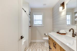 a bathroom with a sink and a toilet at Fenced Yard Lakeland Home Adjacent to Golf Course in Lakeland +19 photos