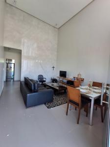 a living room with a couch and a table at Casa da praia in Tutóia
