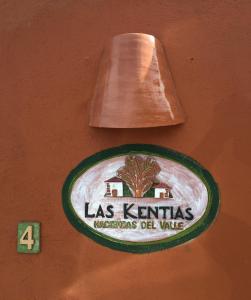 
a sign on a wall with a picture of a dog on it at Haciendas del Valle - Las Kentias in Valle de Guerra
