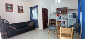 a living room with a couch and a table at Apartamentos Nokal in Masaya