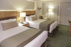 Postel nebo postele na pokoji v ubytování Marriott Tuxtla Gutierrez Hotel