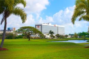a view of a hotel with a golf course and a building at Sheraton Miami Airport Hotel and Executive Meeting Center in Miami