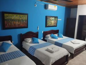 Postel nebo postele na pokoji v ubytování Hotel Sol y Mar